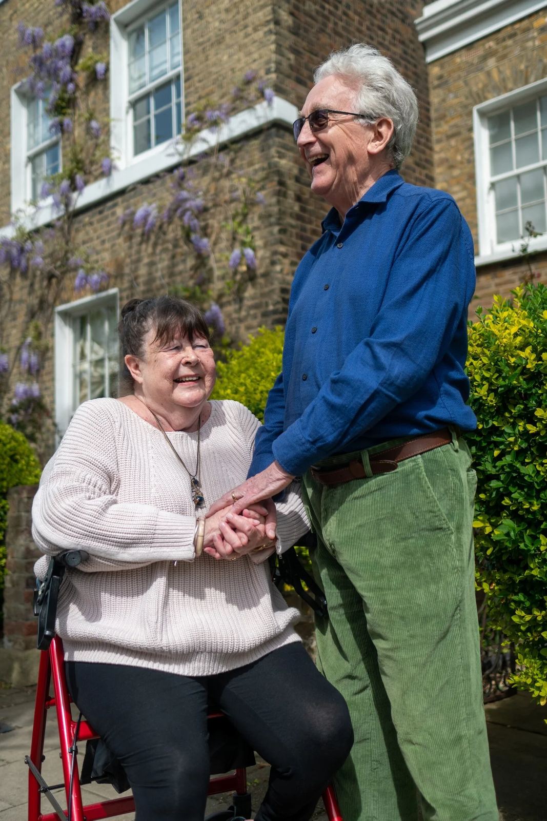A caregiver walking with a person with Parkinson’s